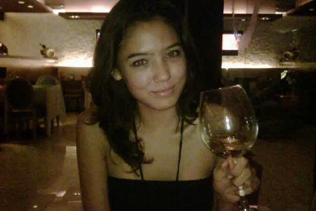 Nicole John, with a drink